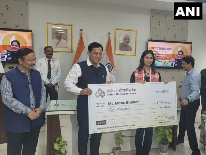 Union Minister Sarbananda Sonowal felicitates double Olympic medalist Manu Bhaker, presents Rs 10 lakhs cheque