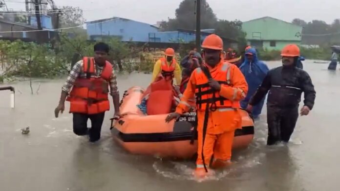 Cyclone Fengal: Disaster personnel use boats to rescue people in flooded Cuddalore