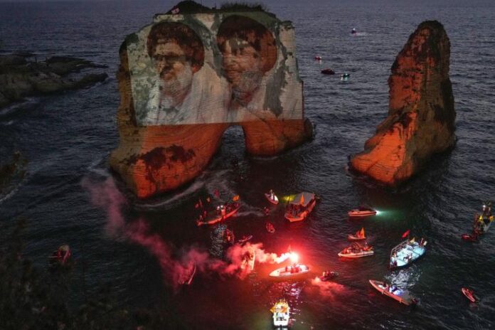Hezbollah Defies Lebanese Government, Projects Leaders' Portraits on Beirut's Raouche Rock