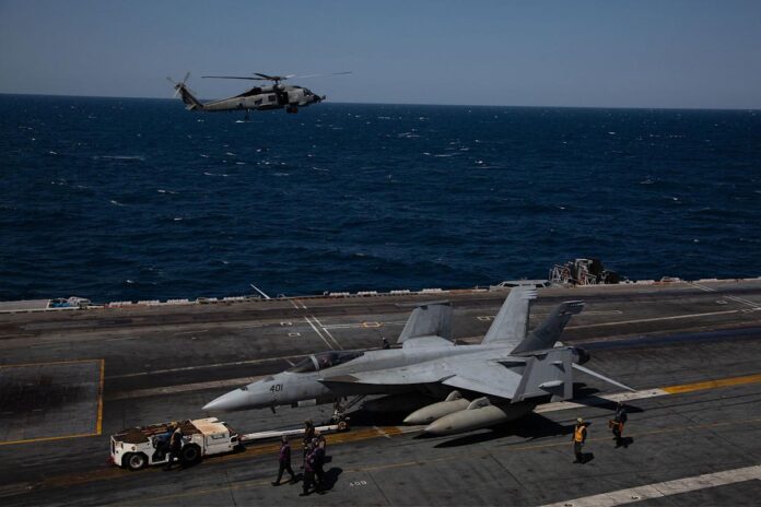 F/A-18F Fighter Jet And MH-60R Helicopter Crash In South China Sea; Crew Members Rescued